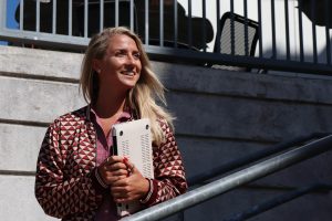 A Two Summers student stands outside