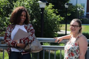 Two Summers students stand outside the Gentry building